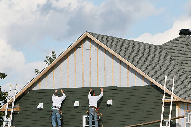 Professional Siding Contractor technician working in Sterling, CO